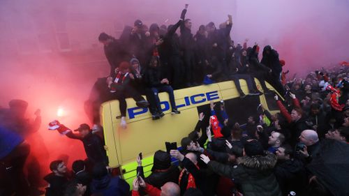 A 53-year-old Reds supporter was allegedly attacked with a belt by Roma fans who had used a side road to enter an area where Liverpool fans were gathering. Picture: AAP.