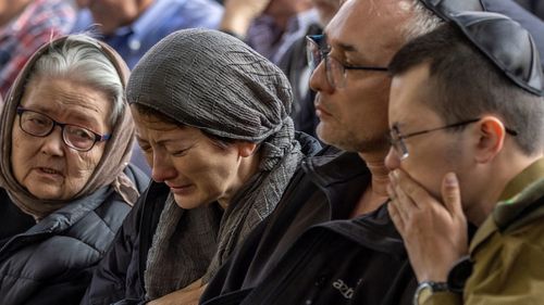 Family mourn during a funeral for Staff Sergeant Major Constantine Sushko on January 01, 2024 in Tel Aviv, Israel.