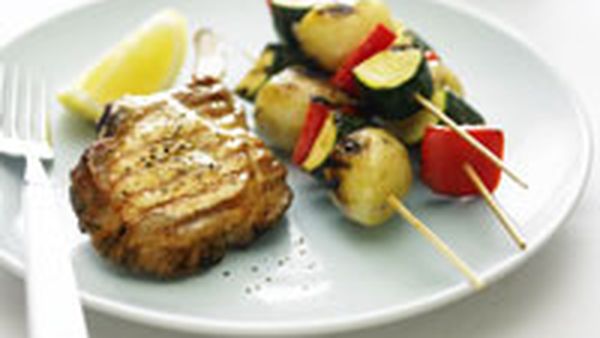 Pork cutlets with glazed vegetable kebabs