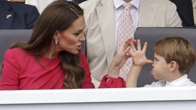 Kate, Duchess of Cambridge, left speaks with Prince Louis, during the Platinum Jubilee Pageant, in London, Sunday June 5, 2022, on the last of four days of celebrations to mark the Platinum Jubilee.  