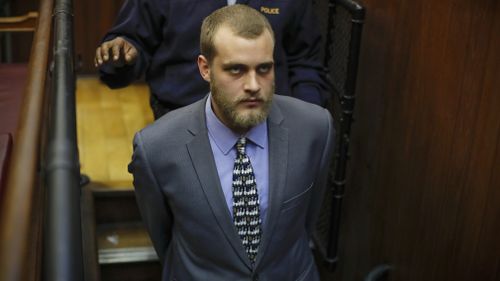Henri van Breda is led from the dock after the sentences were handed down. (AAP)