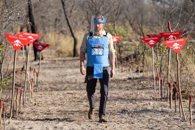 Prince Harry, the Duke of Sussex walks through a minefield in Dirico, Angola, during a visit to see the work of landmine clearance charity the Halo Trust, on day five of the royal tour of Africa, September 27, 2019, following in the footsteps of his late mother Diana, Princess of Wales.