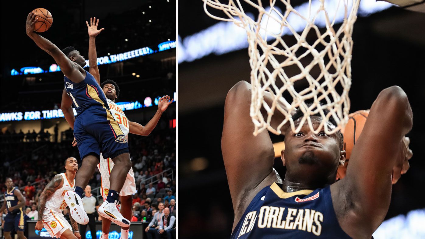 Zion Williamson #1 of the New Orleans Pelicans attempts to dunk over defender Damian Jones #30 of the Atlanta Hawks