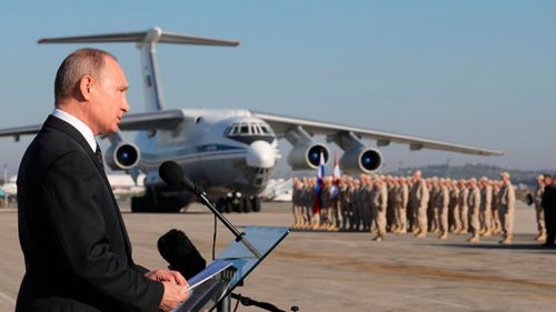  Putin addresses the troops at the Hemeimeem air base in Syria. (AP)