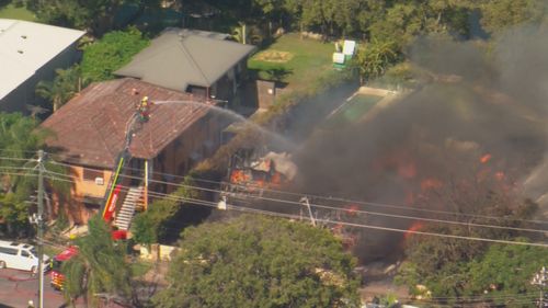 Fire crews are tackling a large house fire in Brisbane's South.