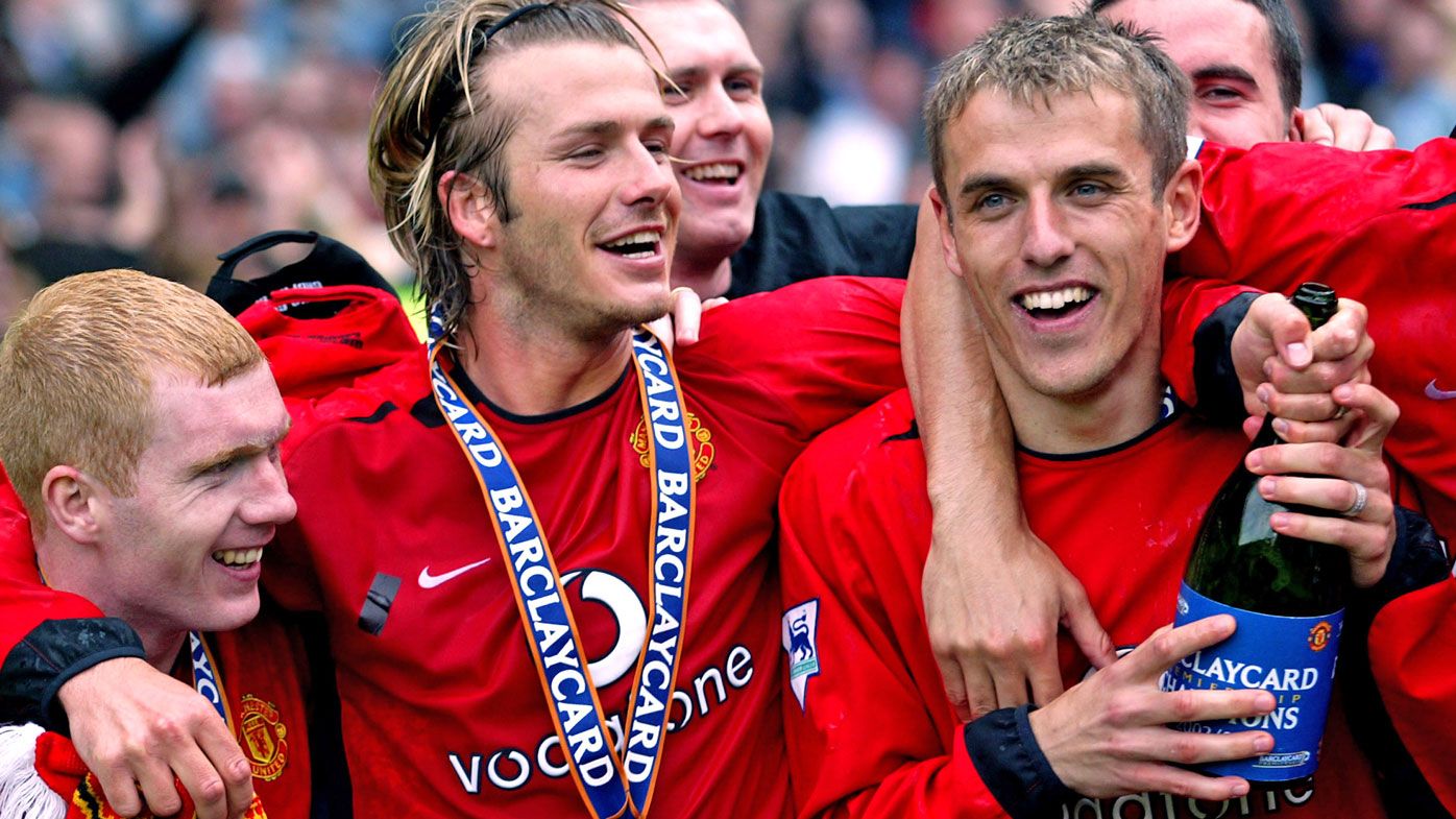 Manchester United&#x27;s Paul Scholes, David Beckham and Phil Neville celebrate winning the Barclaycard Premiership trophy in 2003