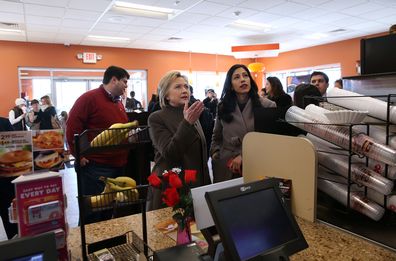 Hillary Clinton (L) and aide Huma Abedin 