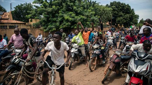 Young men chant slogans against the power of Lieutenant-Colonel Damiba, against France and pro-Russia, in Ouagadougou, Burkina Faso.