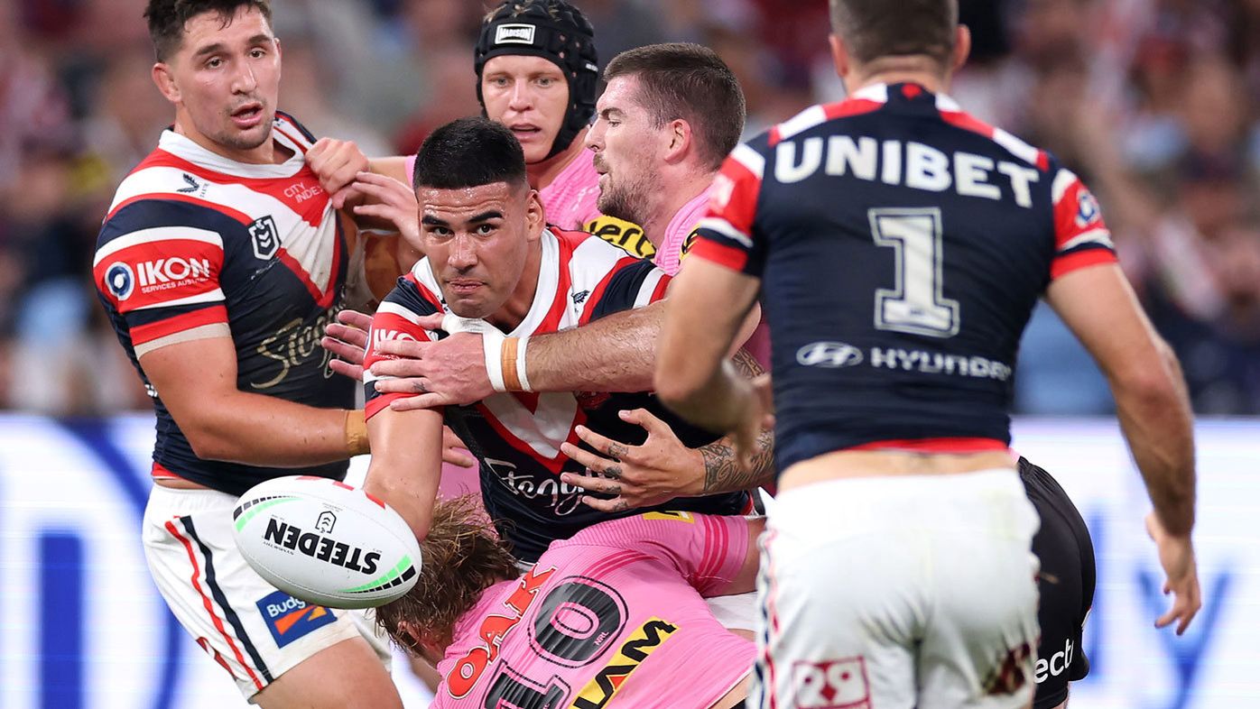 Roosters young gun Terrell May gets an offload away against the Panthers in round four, 2024.