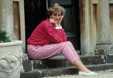 Diana, Princess of Wales (1961 - 1997) sitting on a step at her home, Highgrove House, in Doughton, Gloucestershire, 18th July 1986.