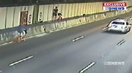 Two Sydney cyclists have been caught on CCTV riding through the CBD's Eastern Distributor tunnel without helmets.