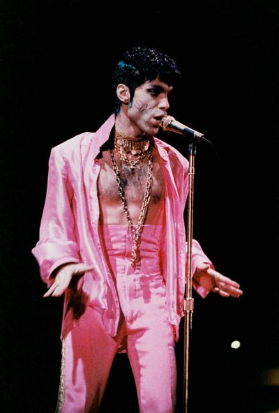 Prince performs on stage wearing his 'Slave' tattoo during 'The Ultimate Live Experience' at Wembley Arena in  1995.
