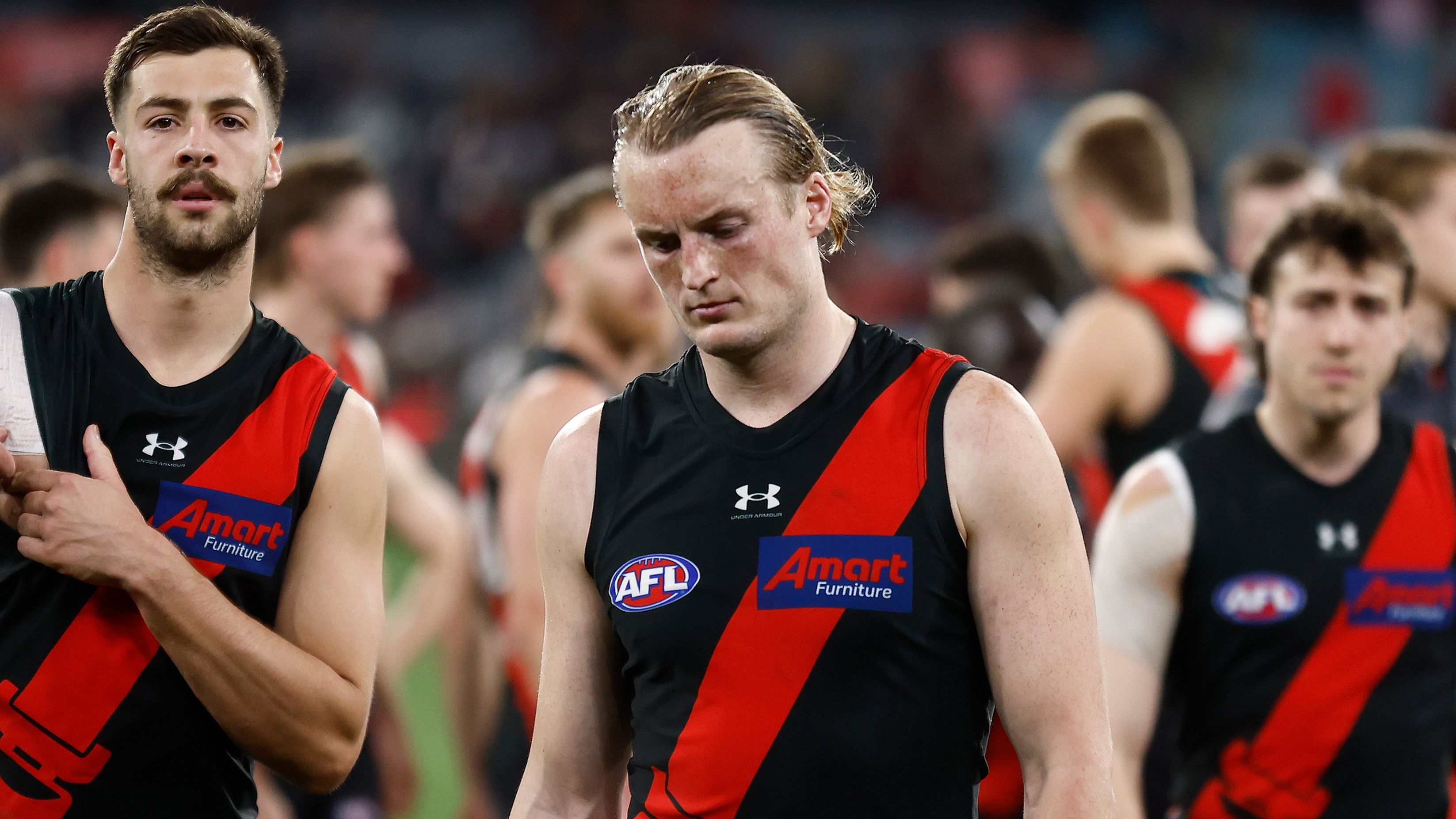 MELBOURNE, AUSTRALIA - AUGUST 25: Mason Redman of the Bombers looks dejected after a loss during the 2023 AFL Round 24 match between the Essendon Bombers and the Collingwood Magpies at Melbourne Cricket Ground on August 25, 2023 in Melbourne, Australia. (Photo by Michael Willson/AFL Photos via Getty Images)