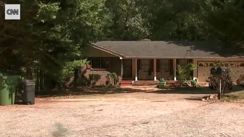 The front yard of the home where three teens were allegedly shot dead while preparing to commit a robbery.