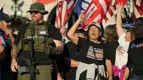 Supporters of President Donald Trump demonstrate outside the Pennsylvania State Capitol.