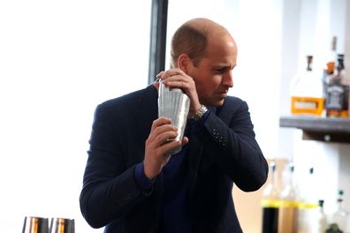 Prince William, Prince of Wales, makes a cocktail during a visit to the Trademarket outdoor market, as part of the royal visit to Northern Ireland on October 6, 2022 in Belfast, Northern Ireland 
