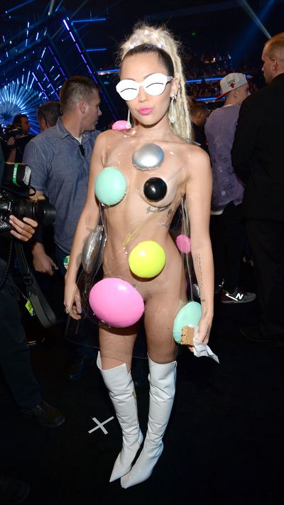 Eye-bras, boob buttons and Barbarella! Miley Cyrus' 2015 VMA outfits were plain bonkers