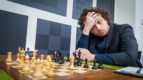 Hans Niemann, pictured playing chess in St. Louis on September 11, has been accused of cheating by five-time world champion Magnus Carlsen. Niemann denies the accusation.