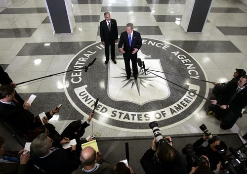 Then US President George W Bush speaks to reporters with then CIA Director Porter Goss at the headquarters of the Central Intelligence Agency 03 March, 2005 in Langley, Virginia.