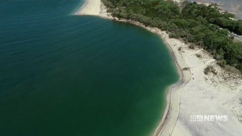 A sinkhole has opened up on a popular Queensland beach.