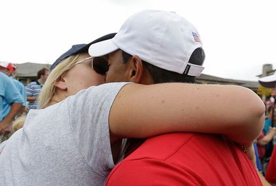 She gave Woods a very public kiss at last year's President's Cup.