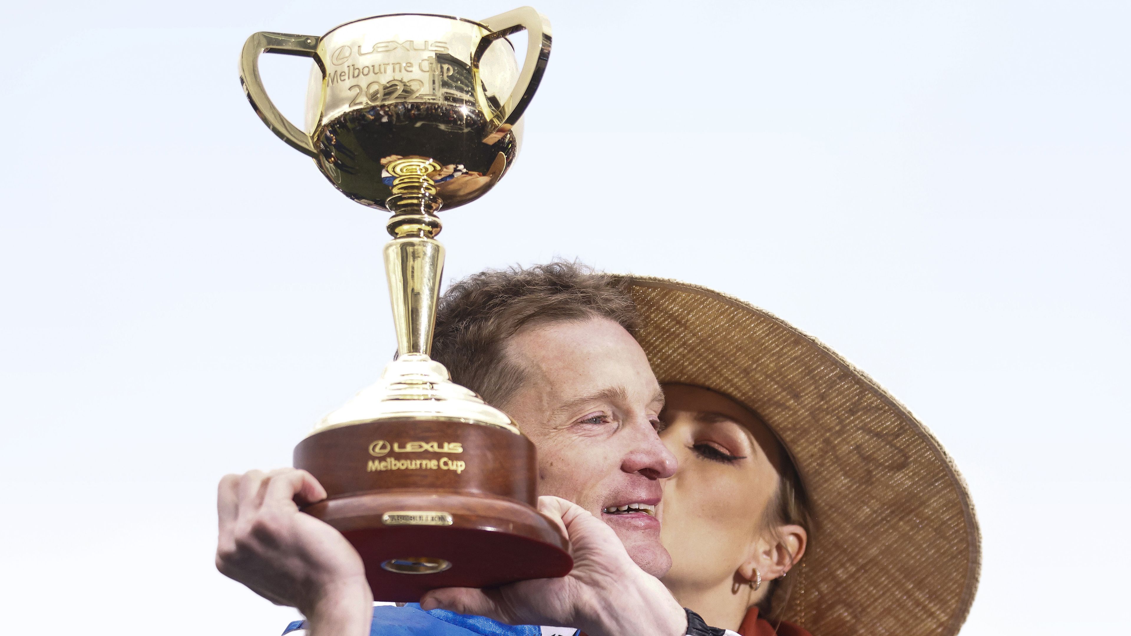 Mark Zahra, who rode Gold Trip to victory, celebrates with the trophy after winning the 2022 Melbourne Cup.