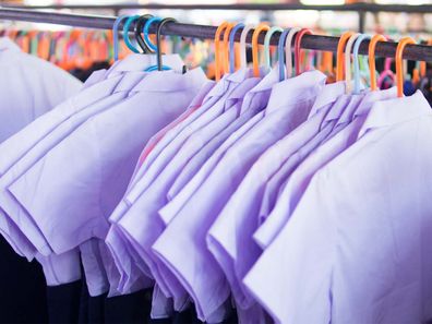 School uniforms hanging on a rack