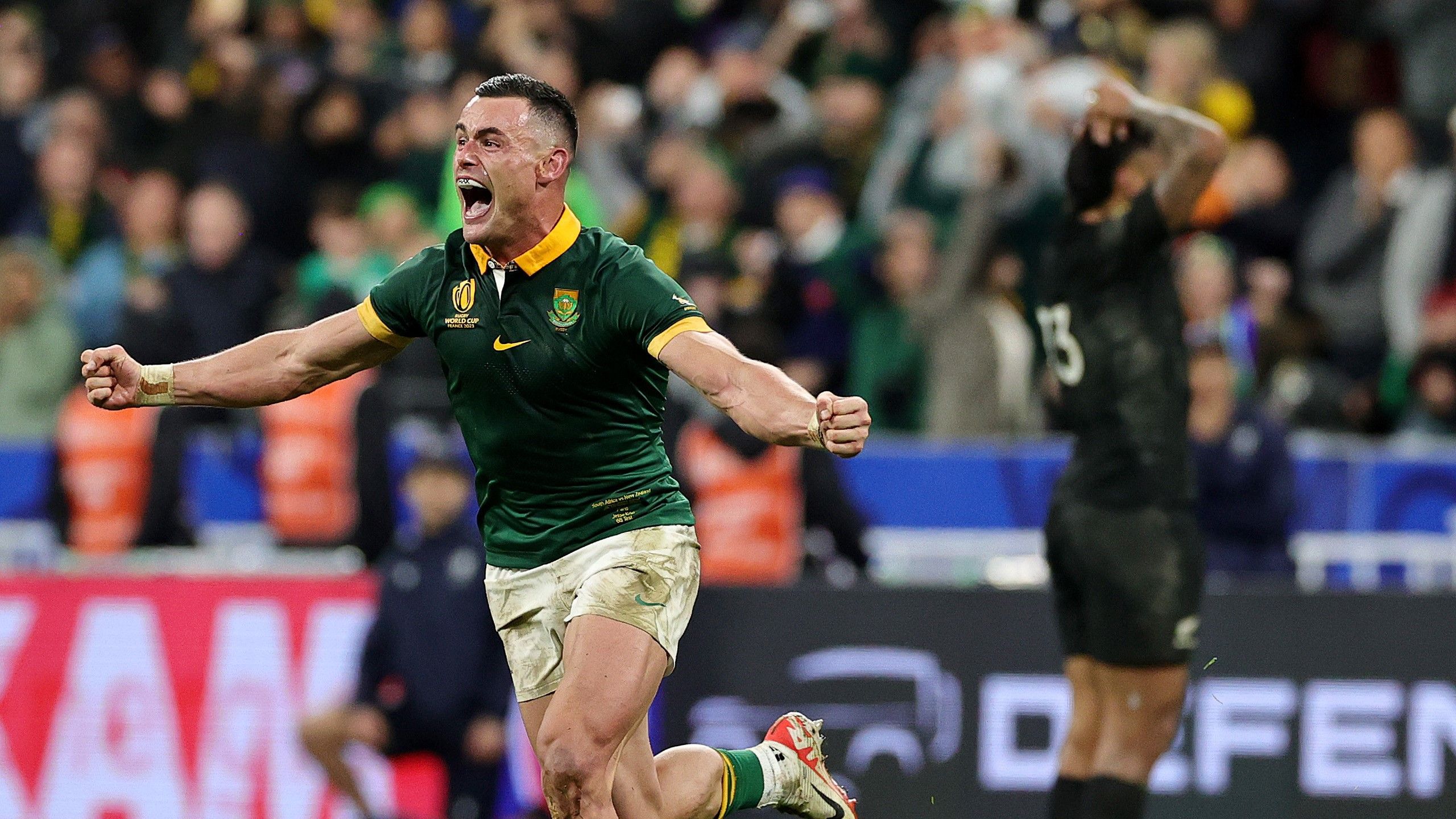 Jesse Kriel of South Africa celebrates following the team&#x27;s victory while New Zealand&#x27;s Rieko Ioane stands in disbelief behind him.