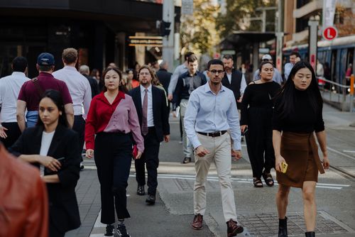 Pedestrians and office workers walk through the Sydney CBD. 