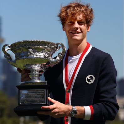 Jannik Sinner of Italy poses with the Norman Brookes Challenge Cup after winning the 2024 Australian Open Final
