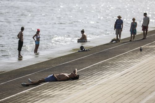 Locals are feeling record breaking temperatures across Portugal. Image: AAP