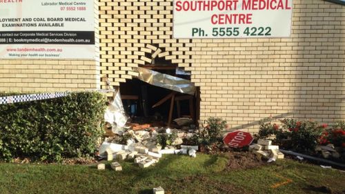 A hole left in the wall of the Southport Medical Centre, where the car crashed. (Brendon Wolf, 9NEWS)