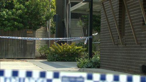 Police have set up a crime scene around the Yeronga apartment where a body was found in a rubbish bin