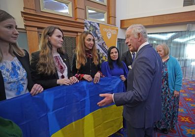 Prince Charles, Prince of Wales meets Ukrainian women (L-R) Luliia Wilson, Kateryna Zaichyk, Maryna Opanasenko and Alina Bilous to hear how organisations across Northern Ireland are supporting refugees, during a reception at Titanic Belfast on March 23, 2022 in Belfast, Northern Ireland