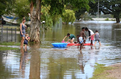 The town of Ingham has been cut in half by floodwaters. (AAP)