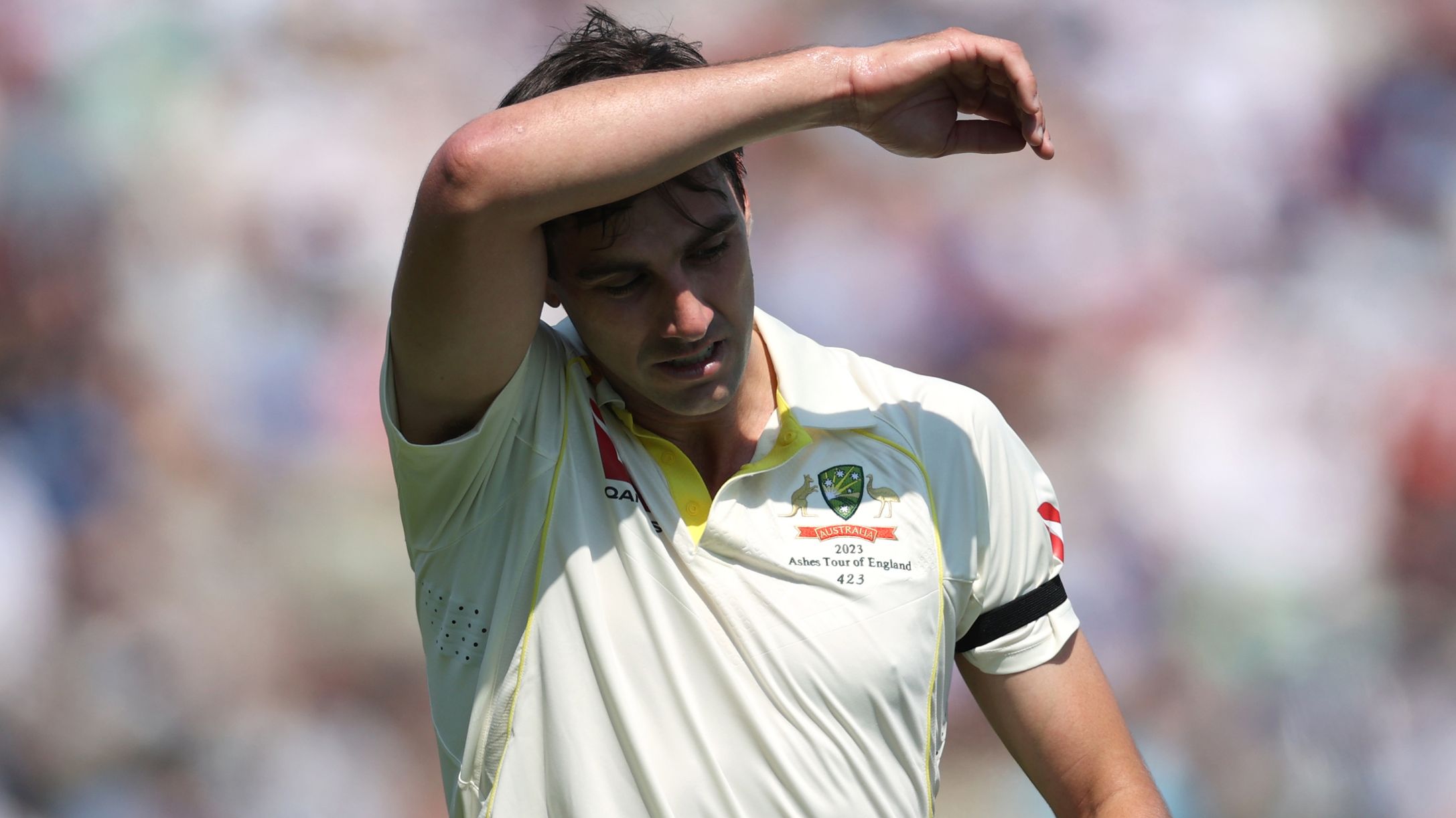 Pat Cummins of Australia wipes his brow as he returns to his mark during Day One of the LV= Insurance Ashes 1st Test match between England and Australia at Edgbaston on June 16, 2023 in Birmingham, England. (Photo by Ryan Pierse/Getty Images)