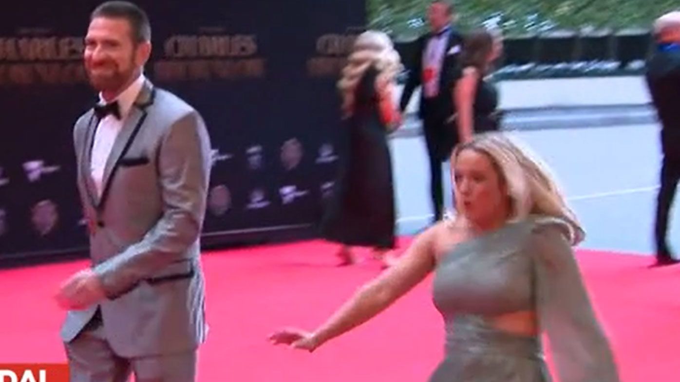 Brisbane Lions great Jason Akermanis&#x27; partner lost her footing due to a bump in the Brownlow Medal red carpet at Crown