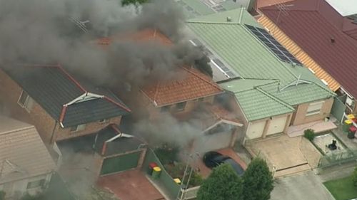 Black smoke was seen pouring from the Carramar house. (9NEWS)