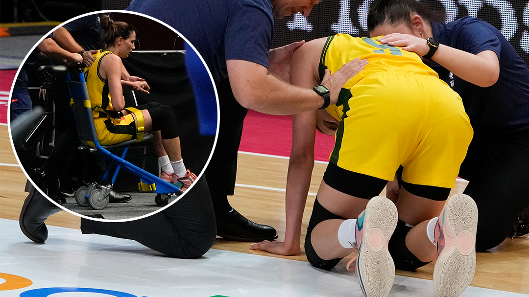 Australia&#x27;s Bec Allen is taken from the arena by medical staff.