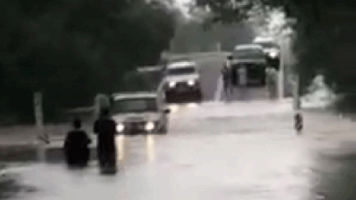 Some cars tried to cross the flooded road. (Facebook: Maddy Cox)