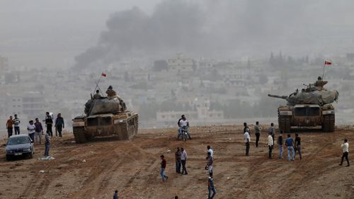 Kurds battle for heart of Kobane as UN fears massacre