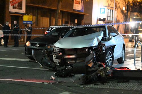 The car crashed into a traffic pole at the intersection of A'Beckett and Queen Streets. Picture: AAP