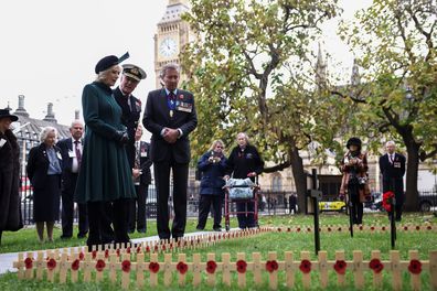 President of The Poppy Factory Surgeon Rear Admiral Lionel Jarvis and National President of the Royal British Legion Lt General James Bashall accompany Camilla, Queen Consort as she attends the 94th Year of The Field Of Remembrance at Westminster Abbey on November 10, 2022 in London 