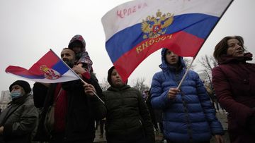Supporters of Serbia&#x27;s Novak Djokovic wave a Russian, right, and Serbian flags during a protest in Belgrade, Serbia, Saturday, Jan. 8, 2022.
