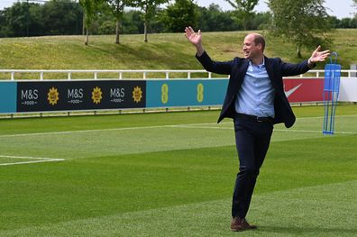 Prince William, Duke of Cambridge celebrates after scoring a goal whilst visiting the England Women's football team at St. George's Park on June 15, 2022 in Burton upon Trent, England. 