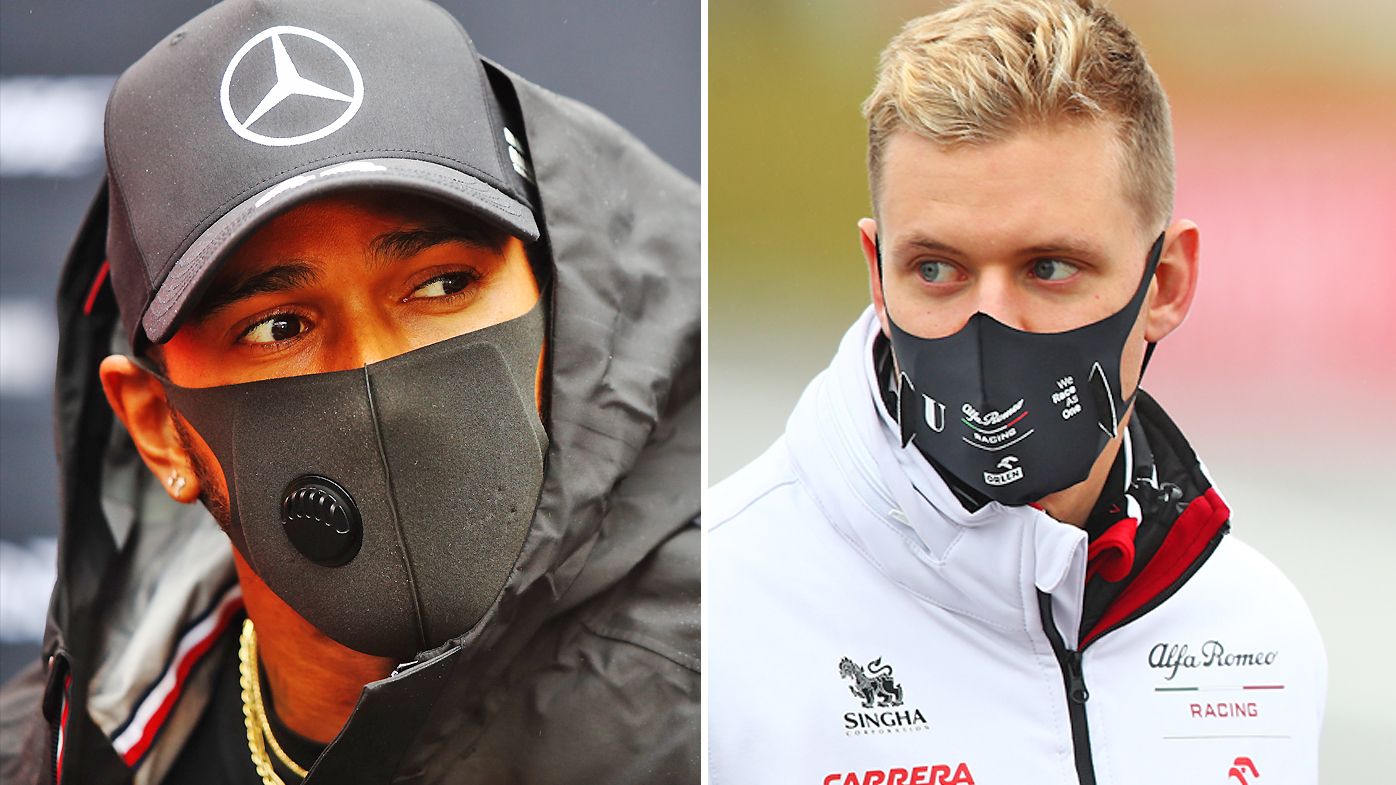 Lewis Hamilton of Great Britain and Mercedes and Mick Schumacher of Germany and Alfa Romeo Racing