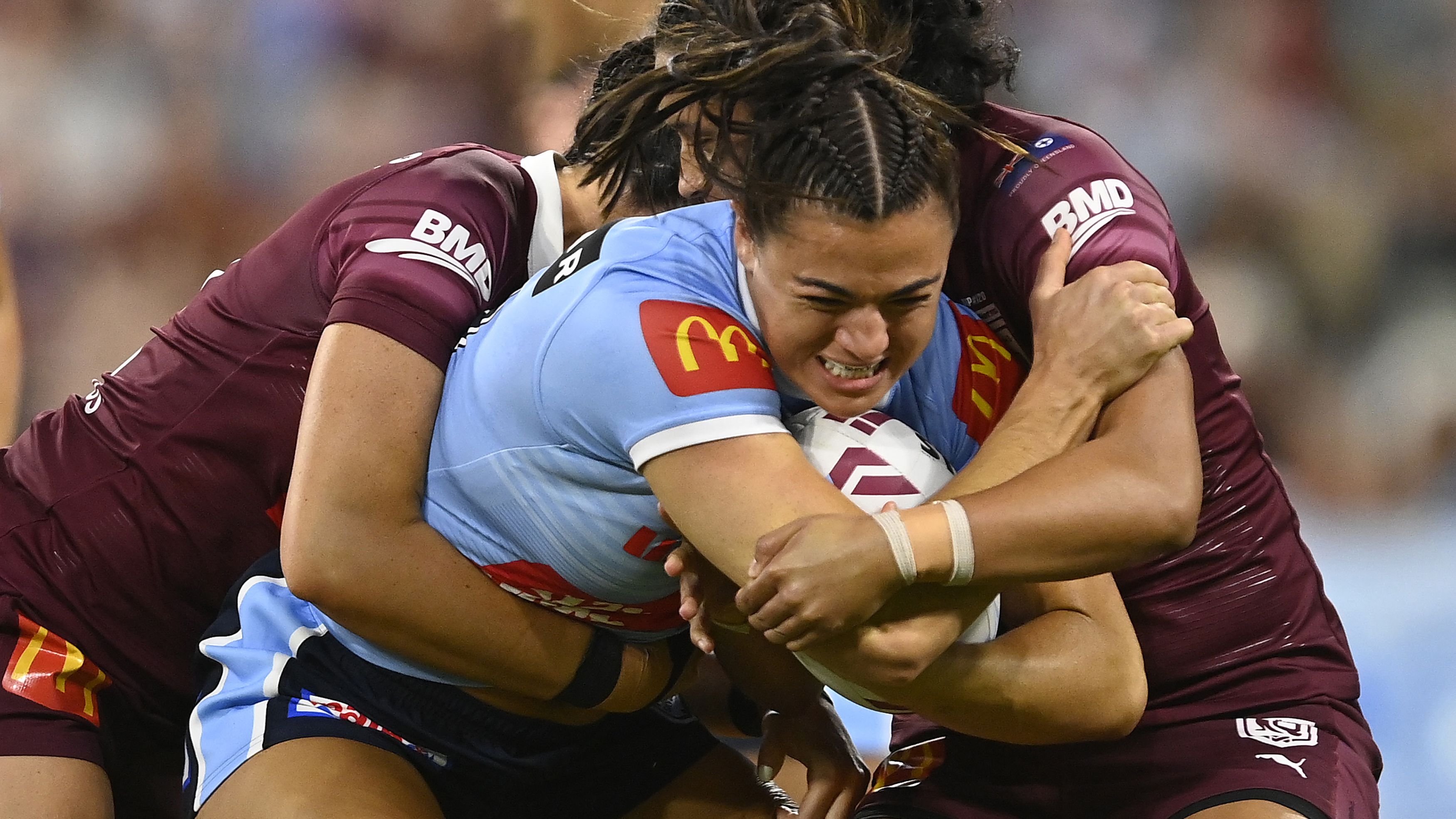 TOWNSVILLE, AUSTRALIA - JUNE 22: Millie Boyle of the Blues is tackled during game two of the women&#x27;s state of origin series between New South Wales Skyblues and Queensland Maroons at Queensland Country Bank Stadium on June 22, 2023 in Townsville, Australia. (Photo by Ian Hitchcock/Getty Images)