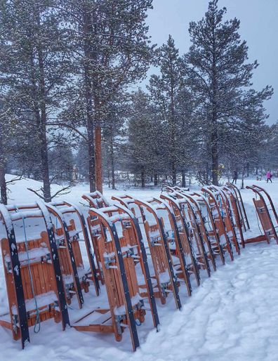 Sleds lined up at Finland's glass igloo Hotel Kakslauttanen