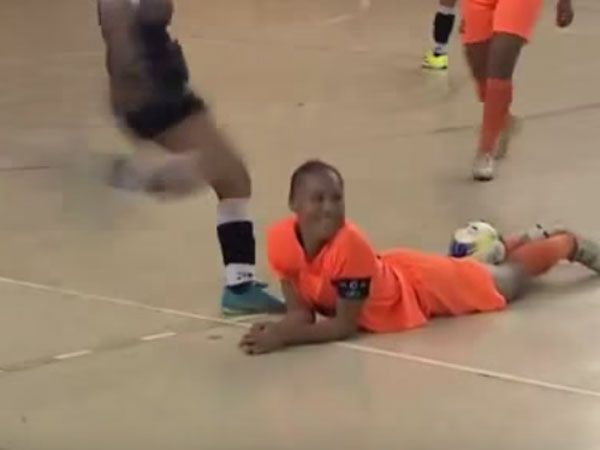 Futsal player kicks rival in the head