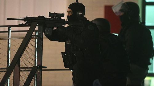 Police are seen during the operation in Reims. (Getty)